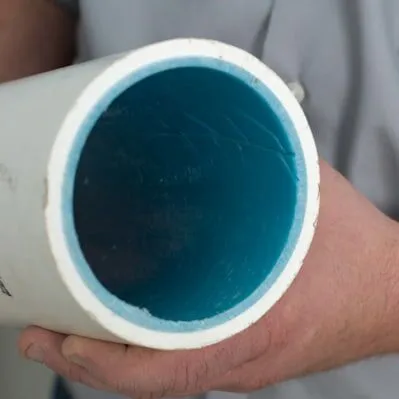 end of pipe with blue relining material inside