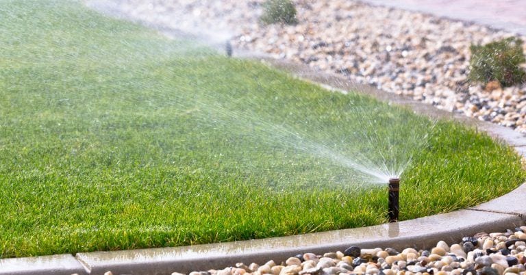 lawn sprinklers watering lawn