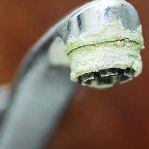 crusty calcium buildup corrosion on sink faucet